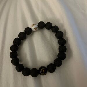 Elegant Black Lava Bead Bracelet with Gold and White Accents